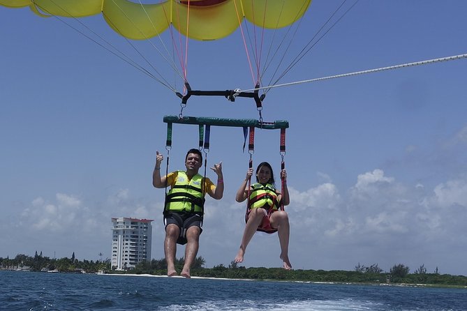 Cancun Adventure: Reef Snorkeling & Parasailing Experience - Parasailing above the Caribbean
