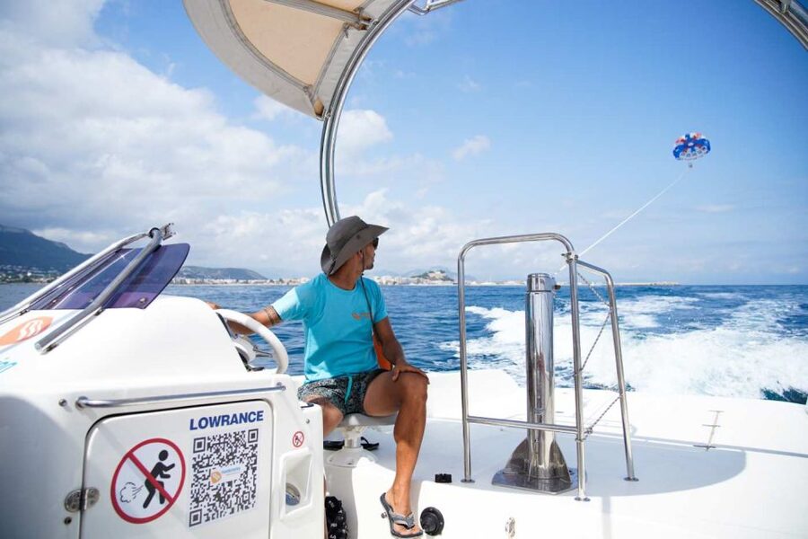 Dénia: Boat Trip & Parasailing Experience with Sunset Option - Getting ready for the parasail flight