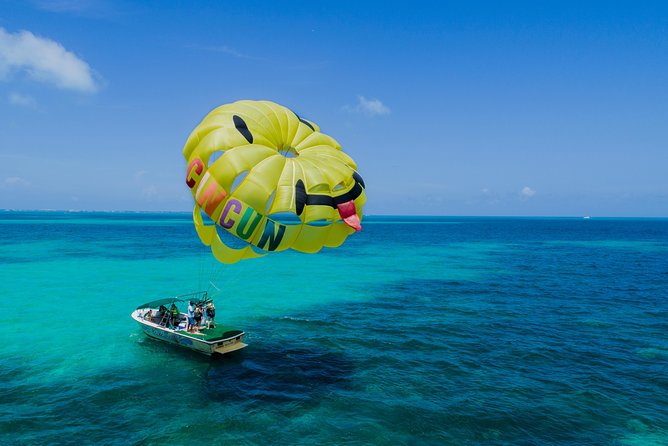 Fly Above Cancun Bay: Parasailing Experience - Briefing, harness, and boat launch