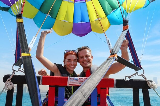 Parasailing in Dubai with Palm Jumeirah and JBR Beach views - Getting fitted into the harness