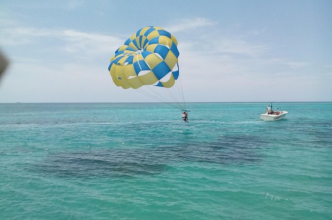 Parasailing Snorkeling and Glass Boat Adventure in Negril - Reef snorkeling with provided fins and masks