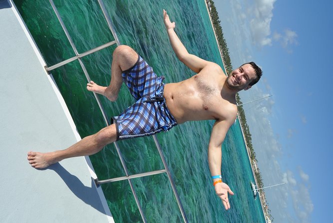 Snorkeling Catamaran Tour & Parasailing - Snorkeling and hookah breathing below the surface