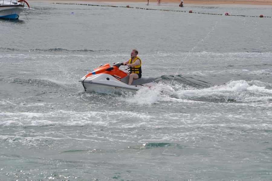Triple Package Self Drive Jet Ski, Banana & Parasailing - Parasailing over the blue water